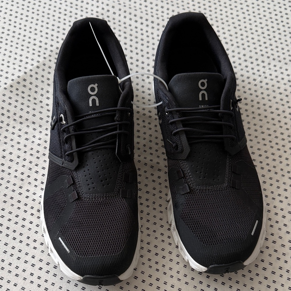 On clouds running shoes black and white.